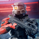 A Spartan holds a battle rifle while standing under a red light in Halo Infinite Tactical Ops slayer.
